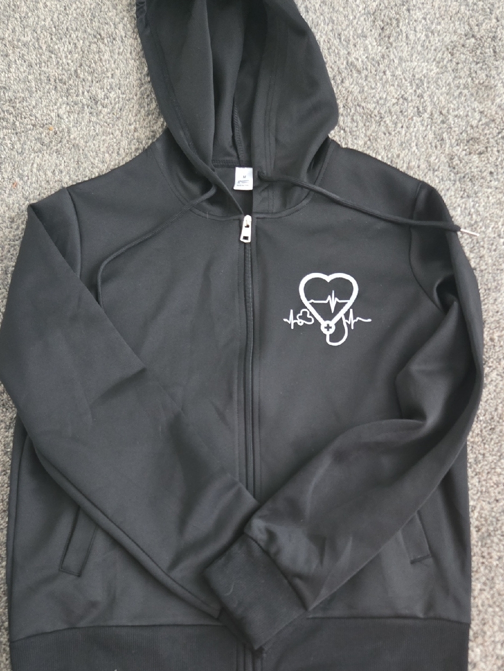 Black Zip-Up Hoodie with White Heartbeat Stethoscope Design